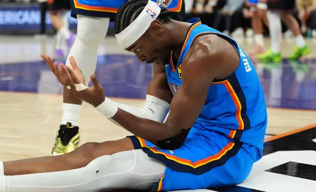 Oklahoma City Thunder guard Shai Gilgeous-Alexander celebrates a scores against the Phoenix Suns during the second half of Game 4 in a first-round NBA playoffs basketball series, Monday, April 27, 2026, in Phoenix. (AP Photo/Ross D. Franklin)