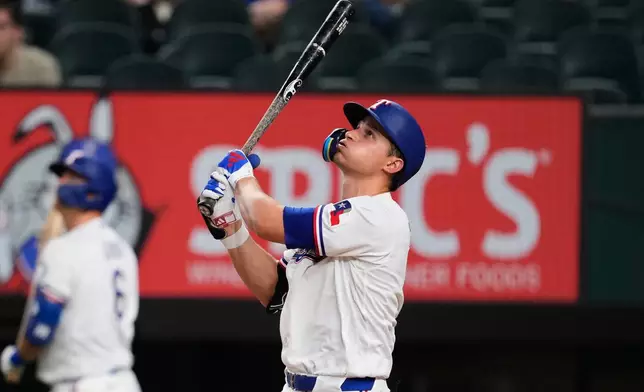 Texas Rangers' Corey Seager watches his fly out to left in the fourth inning of a baseball game against the Arizona Diamondbacks Monday, May 11, 2026, in Arlington, Texas. (AP Photo/Tony Gutierrez)