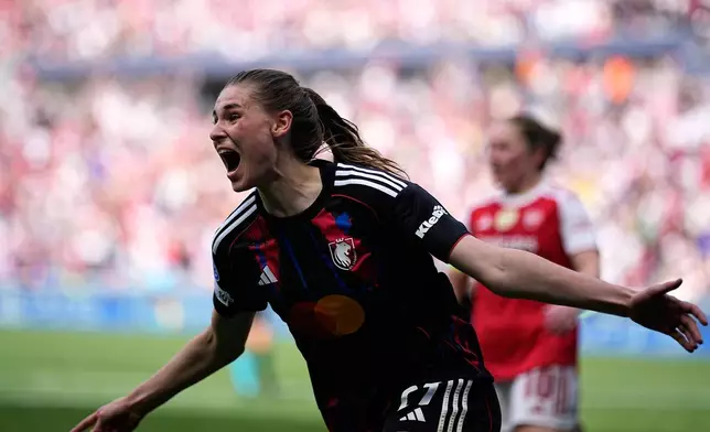 Lyonnes' Jule Brand celebrates after scoring her side's third goal during the Women's Champions League semifinal, second leg, soccer match between OL Lyonnes and Arsenal, in Decines, outside Lyon, France, Saturday, May 2, 2026. (AP Photo/Laurent Cipriani)