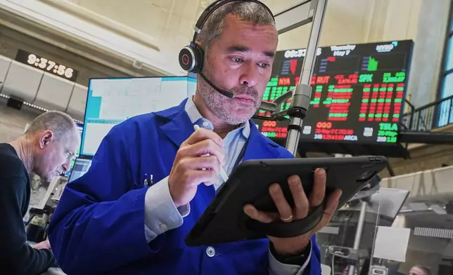 Options trader Justin Kanda works on the floor of the New York Stock Exchange, Thursday, May 7, 2026. (AP Photo/Richard Drew)