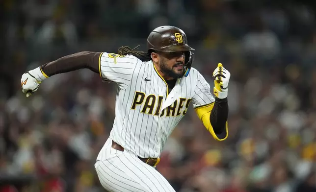 San Diego Padres' Fernando Tatis Jr. runs to first on his way to a single during the seventh inning of a baseball game against the St. Louis Cardinals Thursday, May 7, 2026, in San Diego. (AP Photo/Gregory Bull)