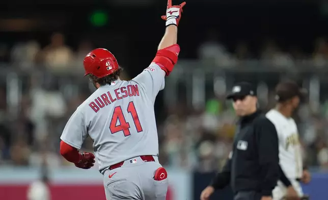 St. Louis Cardinals' Alec Burleson celebrates his home run during the fourth inning of a baseball game against the San Diego Padres Thursday, May 7, 2026, in San Diego. (AP Photo/Gregory Bull)