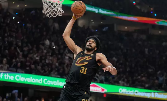 Cleveland Cavaliers center Jarrett Allen (31) goes up for a dunk in the second half in Game 7 of a first-round NBA basketball playoffs series agaist the Toronto Raptors in Cleveland, Sunday, May 3, 2026. (AP Photo/Sue Ogrocki)