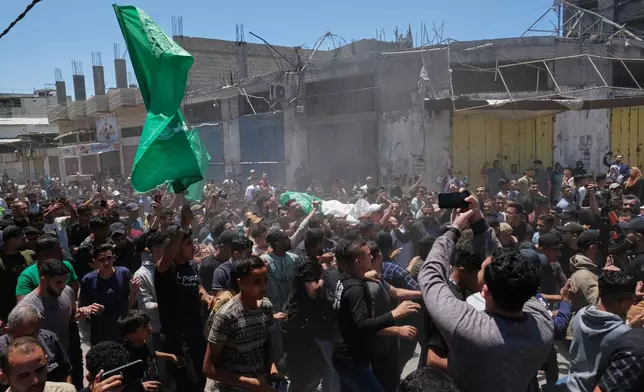 Palestinians attend the funerals of Hamas militant Imad Isleim, his wife and daughter, who were killed in an Israeli military strike, outside Al-Shafi'i Mosque in Gaza City, Thursday, May 28, 2026. (AP Photo/Jehad Alshrafi) CORRECTION: Corrects surname from al-Salem to Isleim