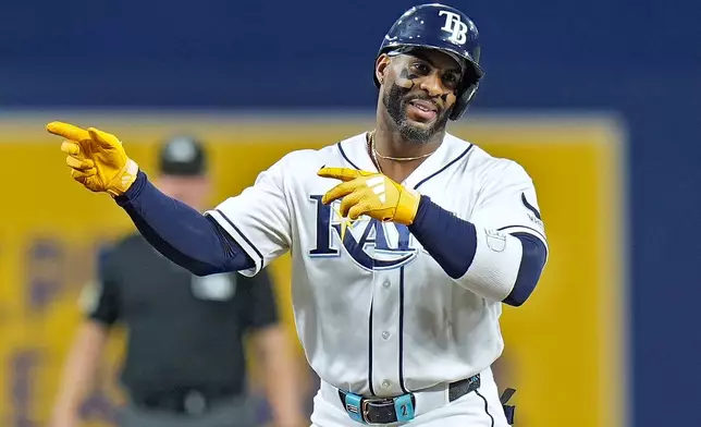 Tampa Bay Rays' Yandy Díaz reacts after hitting a double off Baltimore Orioles pitcher Trevor Rogers during the first inning of a baseball game Monday, May 18, 2026, in St. Petersburg, Fla. (AP Photo/Chris O'Meara)