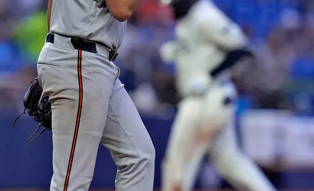 Baltimore Orioles pitcher Cameron Foster (65) reacts after giving up a three-run home run to Tampa Bay Rays' Junior Caminero reacts as during the fifth inning of a baseball game Monday, May 18, 2026, in St. Petersburg, Fla. (AP Photo/Chris O'Meara)