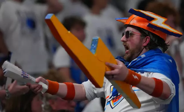 A Oklahoma City Thunder fan cheers in the first half of Game 5 in the Western Conference finals NBA basketball playoffs series between the San Antonio Spurs and the Oklahoma City Thunder, Tuesday, May 26, 2026, in Oklahoma City. (AP Photo/Julio Cortez)