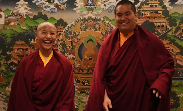Buddhist lamas, Trulshik Yangsi Rinpoche, left, and Jalue Dorje, who is recognized as the eighth Terchen Taksham Rinpoche, laugh while posing for a portrait at the Yak and Yeti hotel in Kathmandu, Nepal, on Tuesday, April 7, 2026. (AP Photo/Luis Andres Henao)
