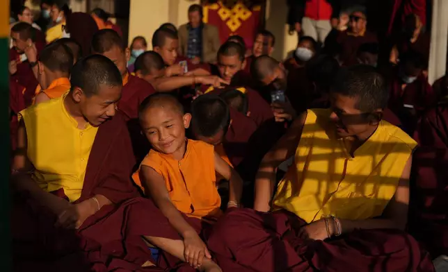 Young monks smile during a break from rituals and teachings at Shechen Monastery in Kathmandu, Nepal, on Thursday, April 9, 2026. (AP Photo/Luis Andres Henao)