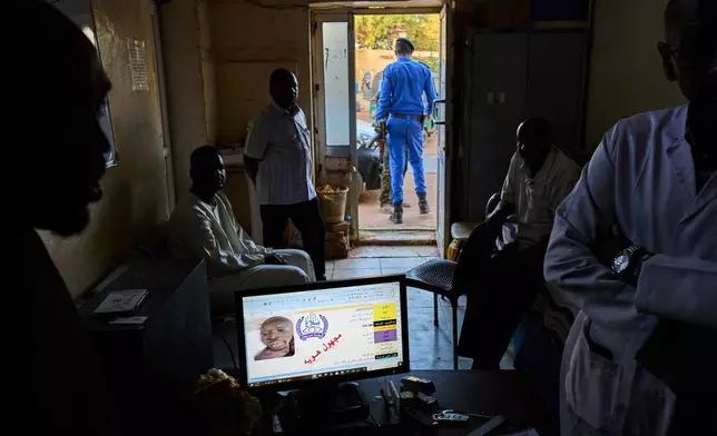 A computer screen displays a record of an unidentified body in the missing persons database at Al Nao Hospital in Omdurman, Sudan, Saturday, April 18, 2026. (AP Photo/Bernat Armangue)