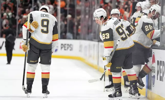 Vegas Golden Knights' Jack Eichel (9) and Mitch Marner (93) react after their loss to the Anaheim Ducks in Game 4 of an NHL hockey playoff series Sunday, May 10, 2026, in Anaheim, Calif. (AP Photo/Scott Strazzante)