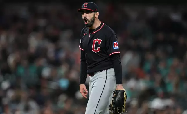 Cleveland Guardians pitcher Colin Holderman reacts to the final out against the Detroit Tigers during the nintth inning of a baseball game Wednesday, May 20, 2026, in Detroit. (AP Photo/Paul Sancya)