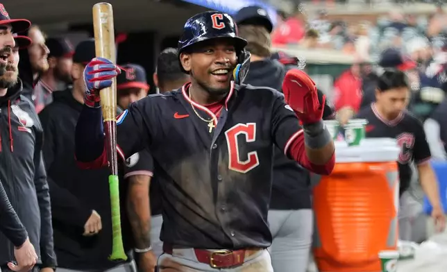 Cleveland Guardians' Angel Martínez celebrates scoring against the Detroit Tigers during the 10th inning of a baseball game Wednesday, May 20, 2026, in Detroit. (AP Photo/Paul Sancya)