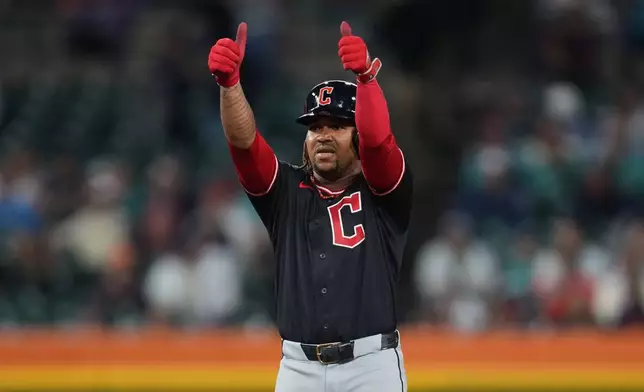 Cleveland Guardians' José Ramírez reacts to his one-run double against the Detroit Tigers during the 10th inning of a baseball game Wednesday, May 20, 2026, in Detroit. (AP Photo/Paul Sancya)