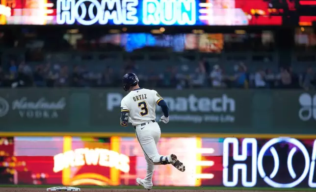 Milwaukee Brewers' Joey Ortiz rounds the bases after hitting a solo home run during the third inning of a baseball game against the San Diego Padres, Tuesday, May 12, 2026, in Milwaukee. (AP Photo/Aaron Gash)