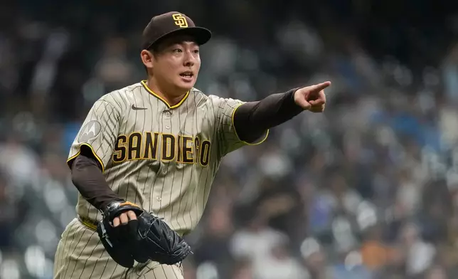 San Diego Padres' Yuki Matsui gestures during the seventh inning of a baseball game against the Milwaukee Brewers, Tuesday, May 12, 2026, in Milwaukee. (AP Photo/Aaron Gash)