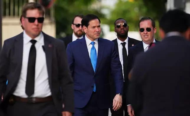United States Secretary of State Marco Rubio, center left, and US Ambassador to India Sergio Gor, arrive to attend a dedication ceremony for an annex building at the U.S. Embassy in New Delhi, India, Saturday, May 23, 2026. (AP Photo/Julia Demaree Nikhinson, Pool)
