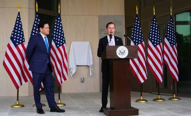 United States Secretary of State Marco Rubio, left, waits as US Ambassador to India Sergio Gor, speaks at a dedication ceremony for an annex building at the U.S. Embassy in New Delhi, India, Saturday, May 23, 2026. (AP Photo/Julia Demaree Nikhinson, Pool)
