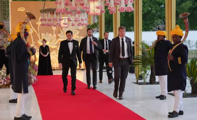 United States Secretary of State Marco Rubio walks the red carpet before attending a reception at Roosevelt House, Saturday, May 23, 2026, at the U.S. Embassy in New Delhi, India. (AP Photo/Julia Demaree Nikhinson, Pool)