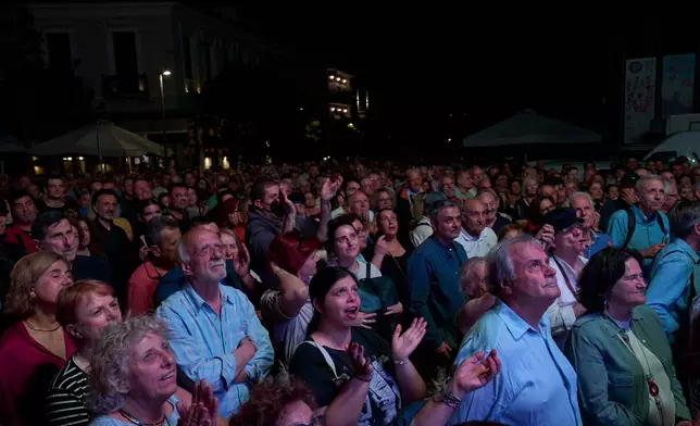 Suporters clap hands as they listen to a speech by former left-wing Prime Minister Alexis Tsipras at an event to launch a new political party ahead of elections next year, in Athens, on Tuesday, May 26, 2026. (AP Photo/Petros Giannakouris)