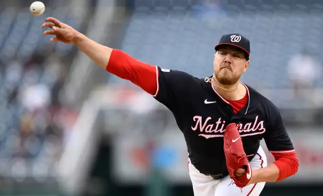 Washington Nationals pitcher Cade Cavalli throws during the third inning of a baseball game against the New York Mets, Thursday, May 21, 2026, in Washington. (AP Photo/Nick Wass)