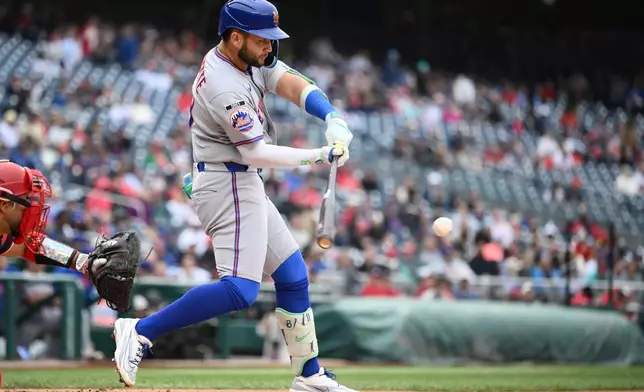 New York Mets' Bo Bichette drives in two runs with a single during the third inning of a baseball game against the Washington Nationals, Thursday, May 21, 2026, in Washington. (AP Photo/Nick Wass)