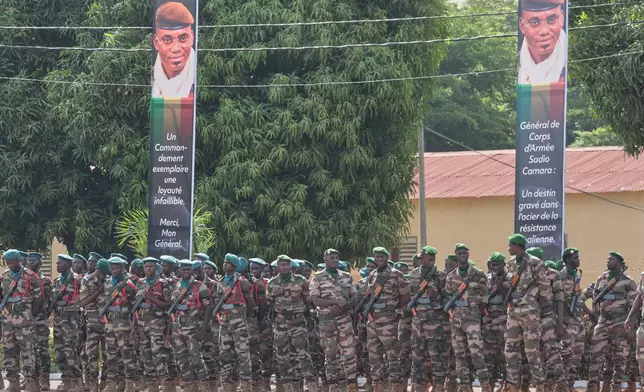 Soldiers wait for the start of the funeral for Mali's former defense minister Sadio Camara at the Military Engineering Parade Ground in Bamako, Mali, Thursday, April 30, 2026. (AP Photo/Boubacary Bocoum)