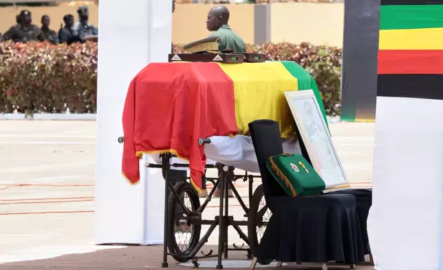 The flag draped casket that contains the remains of Mali's former defense minister Sadio Camara during a funeral ceremony at the Military Engineering Parade Ground in Bamako, Mali, Thursday, April 30, 2026. (AP Photo/Boubacary Bocoum)