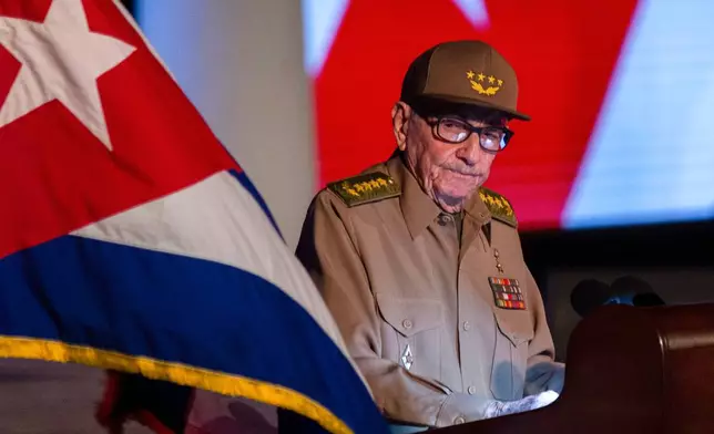 FILE - Former Cuban President Raul Castro looks at the Cuban flag during his speech at the event celebrating the 65th anniversary of the triumph of the revolution in Santiago, Cuba, Jan. 1, 2024. (AP Photo/Ismael Francisco, File)