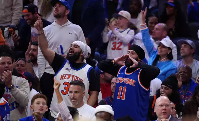New York Knicks' fan react during the second half of Game 3 in a second-round NBA basketball playoff series against the Philadelphia 76ers Friday, May 8, 2026, in Philadelphia. (AP Photo/Matt Slocum)