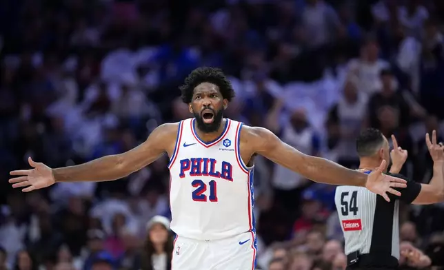 Philadelphia 76ers' Joel Embiid reacts after a foul call during the first half of Game 3 in a second-round NBA basketball playoff series against the New York Knicks Friday, May 8, 2026, in Philadelphia. (AP Photo/Matt Slocum)