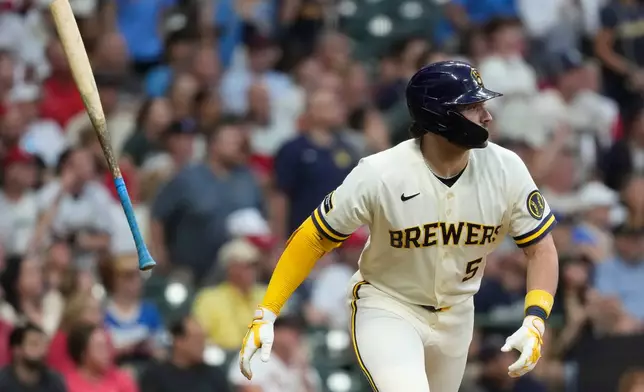 Milwaukee Brewers' Garrett Mitchell flips his bat after hitting a three-run home run during the fifth inning of a baseball game against the St. Louis Cardinals, Tuesday, May 26, 2026, in Milwaukee. (AP Photo/Aaron Gash)