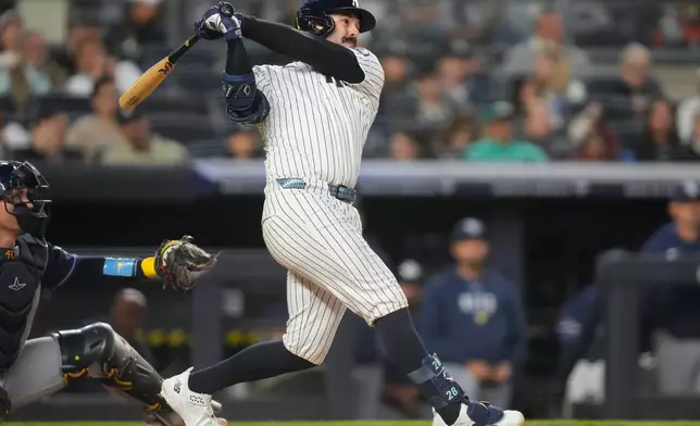 New York Yankees' Austin Wells hits a home run during the fifth inning of a baseball game against the Tampa Bay Rays, Friday, May 22, 2026, in New York. (AP Photo/Yuki Iwamura)
