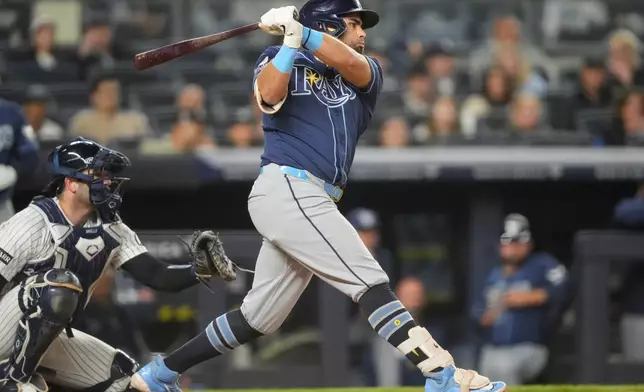 Tampa Bay Rays' Jonathan Aranda, right, hits an RBI double during the eighth inning of a baseball game against the New York Yankees, Friday, May 22, 2026, in New York. (AP Photo/Yuki Iwamura)