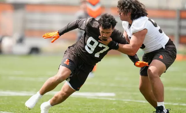 Brothers, Cleveland Browns defensive end Logan Fano (97) and tackle Spencer Fano, right, during the NFL football team's rookie minicamp, Friday, May 8, 2026, in Berea, Ohio. (AP Photo/Sue Ogrocki)