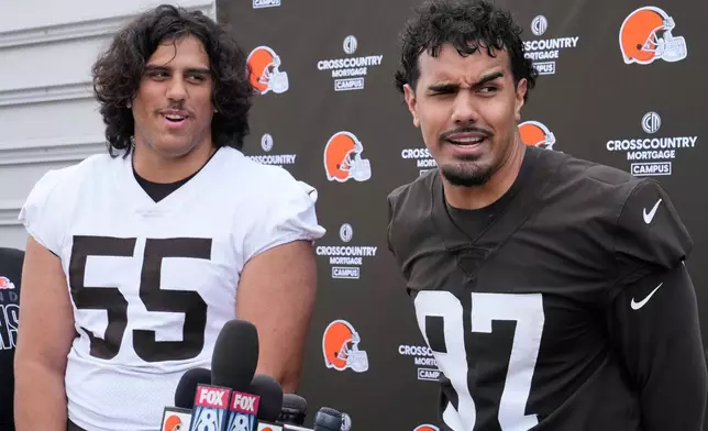 Cleveland Browns tackle Spencer Fano (55) and his brother, defensive end Logan Fano (97) talk with the media after the NFL football team's rookie minicamp, Friday, May 8, 2026, in Berea, Ohio. (AP Photo/Sue Ogrocki)