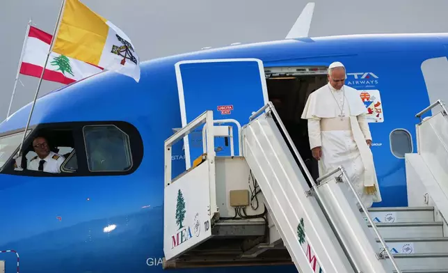 FILE - Pope Leo XIV arrives at Beirut's international airport, Lebanon, Sunday, Nov. 30, 2025. (AP Photo/Domenico Stinellis, File)
