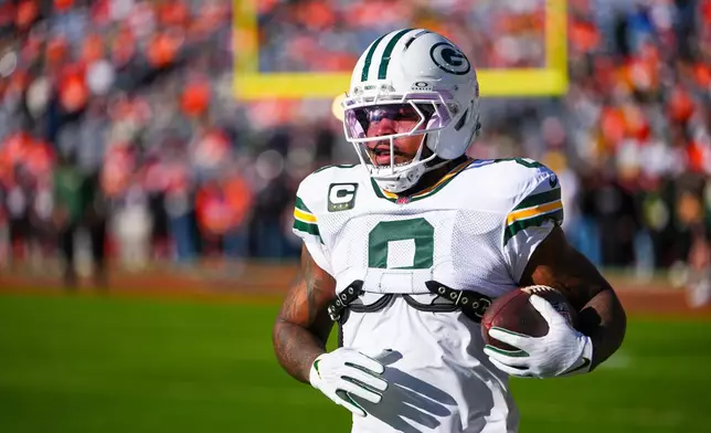 FILE - Green Bay Packers running back Josh Jacobs warms up before an NFL football game against the Denver Broncos, Dec. 14, 2025, in Denver. (AP Photo/Jack Dempsey, File)