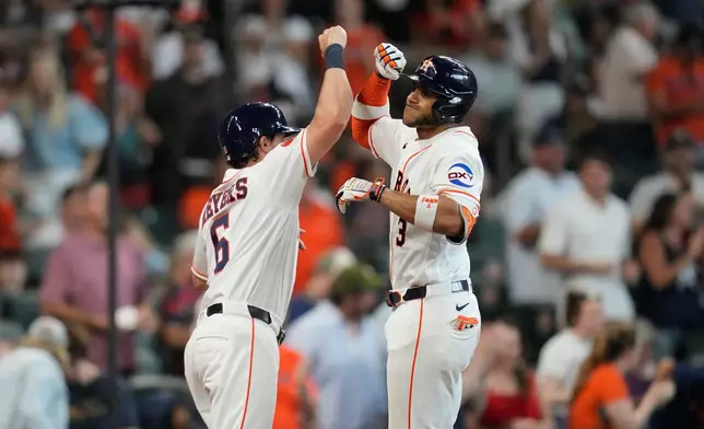 Houston Astros' Jeremy Pena, right, celebrates with Jake Meyers (6) after hitting a two-run home run off Milwaukee Brewers starting pitcher Brandon Sproat during the second inning of a baseball game, Saturday, May 30, 2026, in Houston. (AP Photo/Karen Warren)