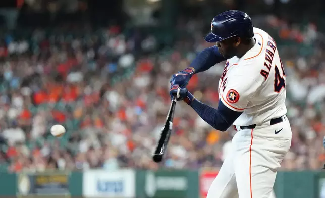 Houston Astros' Yordan Alvarez hits a double off Milwaukee Brewers starting pitcher Brandon Sproat during the first inning of a baseball game, Saturday, May 30, 2026, in Houston. (AP Photo/Karen Warren)