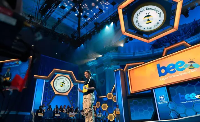 Victoria Li, 12, of Eastvale, Calif., spells his word during the preliminary round of the Scripps National Spelling Bee at DAR Constitution Hall, Tuesday, May 26, 2026, in Washington. (AP Photo/Jose Luis Magana)