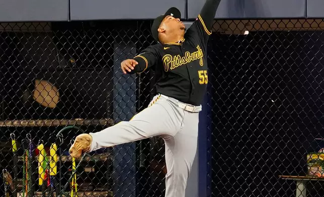 Pittsburgh Pirates outfielder Esmerlyn Valdez (55) can't make the catch on Toronto Blue Jays Kazuma Okamoto double during the second inning of a baseball game in Toronto on Sunday, May 24, 2026. (Frank Gunn/The Canadian Press via AP)