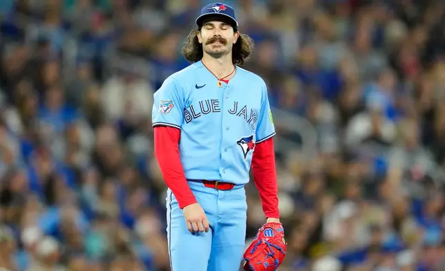 Toronto Blue Jays pitcher Dylan Cease reacts after giving up the second solo home run of the game during the second inning of an baseball game against the Pittsburgh Pirates in Toronto on Sunday, May 24, 2026. (Frank Gunn/The Canadian Press via AP)
