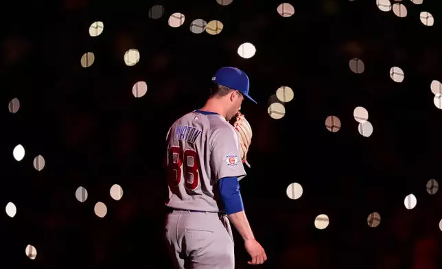 Chicago Cubs pitcher Phil Maton enters the field iin the eighth nning of a baseball game against the Atlanta Braves, Wednesday, May 13, 2026, in Atlanta. (AP Photo/Mike Stewart)