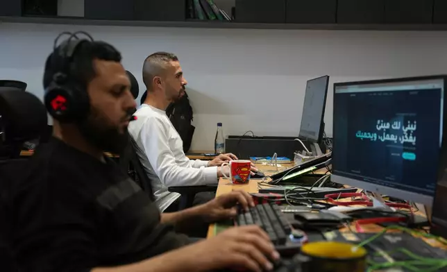 Palestinian digital freelancers work on projects for clients abroad at a coworking space in Gaza City, Tuesday, May 12, 2026. (AP Photo/Abdel Kareem Hana)