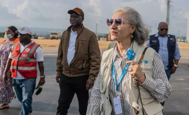 Hela Skhiri, right, UNICEF Country Representative in Ituri Province, arrives at Bunia National Airport to inspect supplies as part of the response to the Ebola virus in Bunia, Congo, Tuesday, May 19, 2026. (AP Photo/Moses Sawasawa)