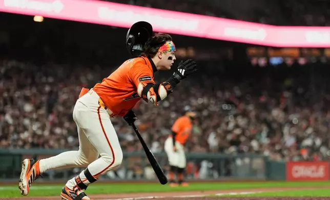 San Francisco Giants' Drew Gilbert runs after hitting an RBI single during the seventh inning of a baseball game against the Pittsburgh Pirates, Friday, May 8, 2026, in San Francisco. (AP Photo/Godofredo A. Vásquez)