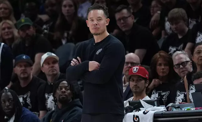 San Antonio Spurs head coach Mitch Johnson watches from the bench during the first half of Game 6 of an NBA basketball second-round playoffs series against the Minnesota Timberwolves in Minneapolis, Friday, May 15, 2026. (AP Photo/Abbie Parr)