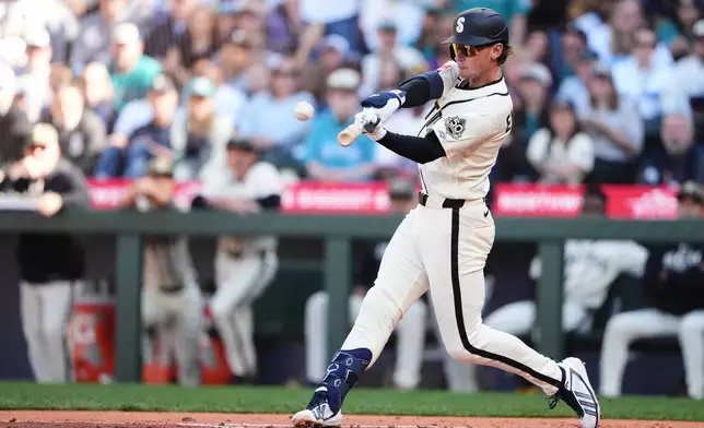 Seattle Mariners' Colt Emerson lines out in his first major league at-bat against the San Diego Padres during the third inning of a baseball game, Sunday, May 17, 2026, in Seattle. (AP Photo/Lindsey Wasson)