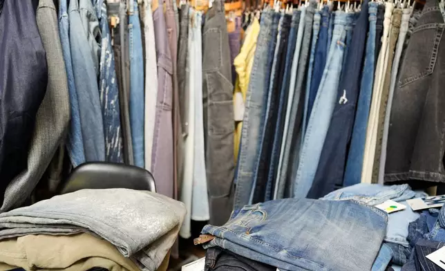 Piles of denim sit in the showroom of BPD Washhouse, a denim processing facility, in Jersey City, N.J., Tuesday, May 5, 2026. (AP Photo/Seth Wenig)